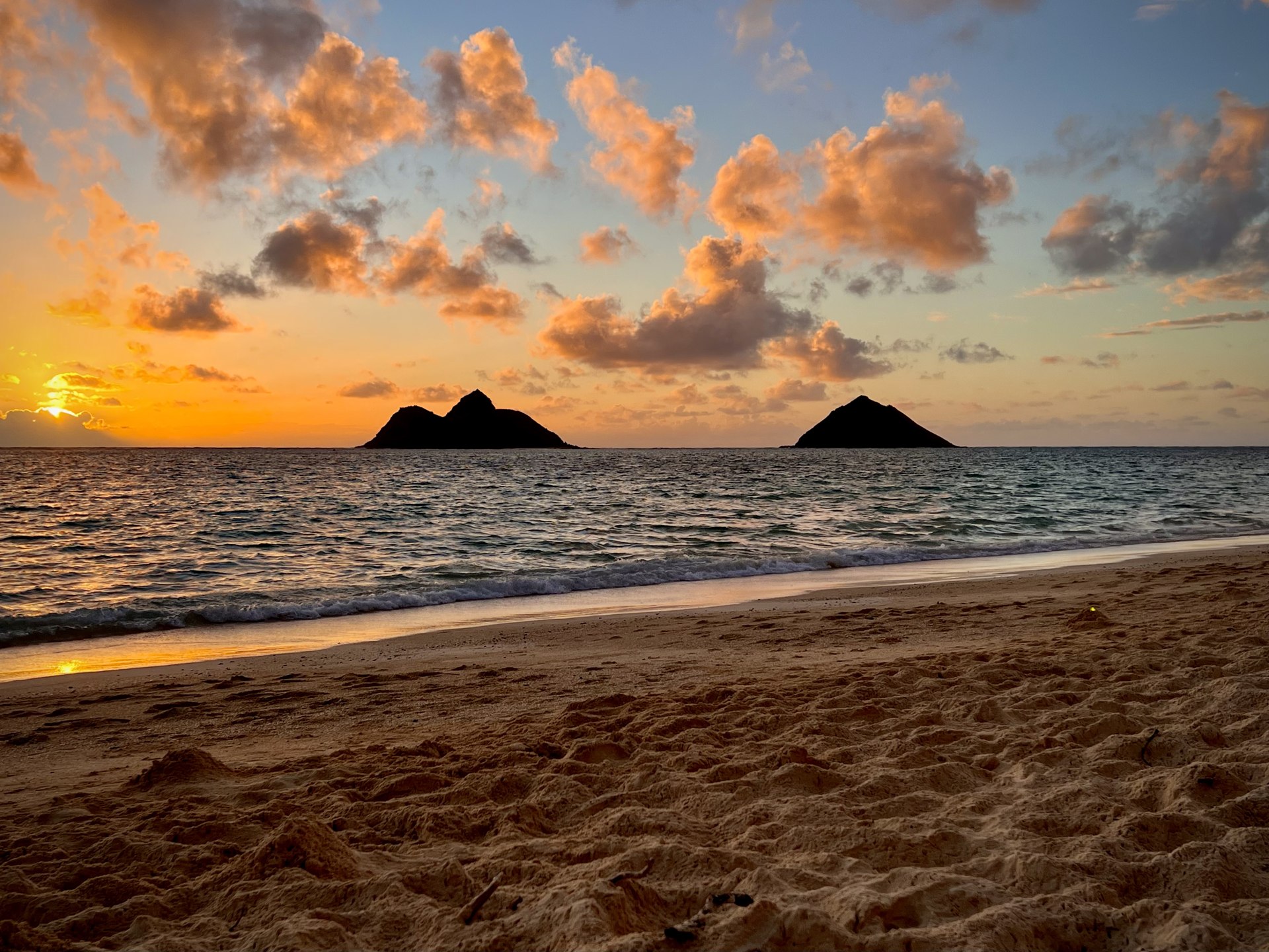 Golden sunrise over Lanikai Beach and the Mokulua Islands